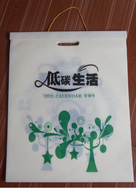 無(wú)紡布袋掛歷批發(fā)，無(wú)紡布掛歷訂做廠家